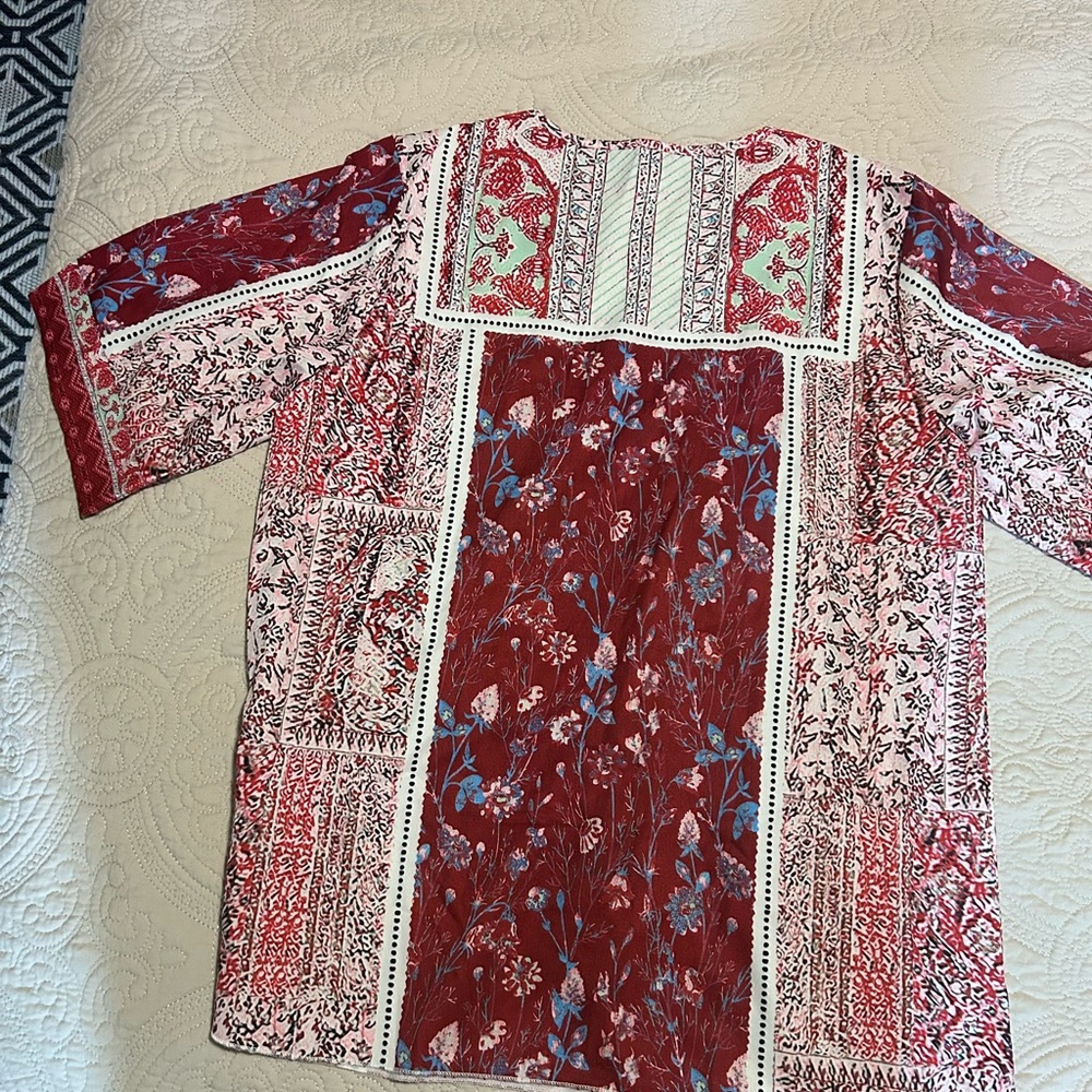 No name shirt. 
Silky polyester.